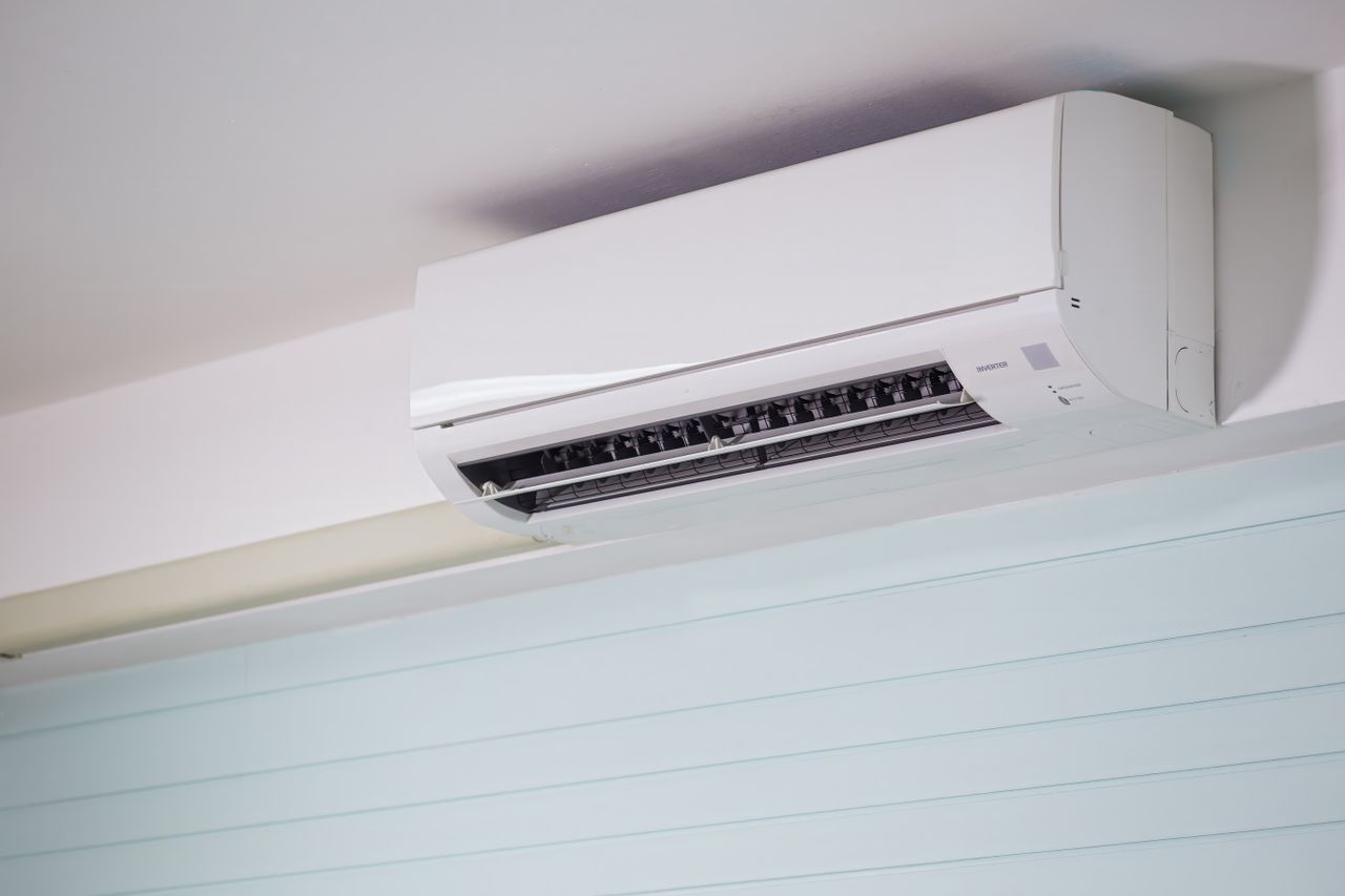 The Art of Drawing Readers In: Your attractive post title goes here Close-up of a wall-mounted air conditioner indoors, showcasing sleek design for modern cooling solutions.